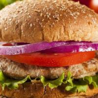 The Turkey Burger · Grilled turkey patty topped on burger buns with lettuce, tomatoes and onions.