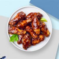 Bbq Bliss Chicken Wings · Fresh chicken wings fried until golden brown, and tossed in barbecue sauce. Served with a si...