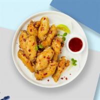 S&C Combo Wings · Fresh chicken wings fried until golden brown, and tossed in sweet chili sauce. Served with a...
