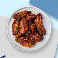 Totally Teriyaki Wings · Fresh chicken wings fried until golden brown, and tossed in teriyaki sauce. Served with a si...