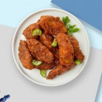 Naughty Nashville Hot Wings · Fresh chicken wings fried until golden brown, and tossed in Nashville Hot Sauce. Served with...