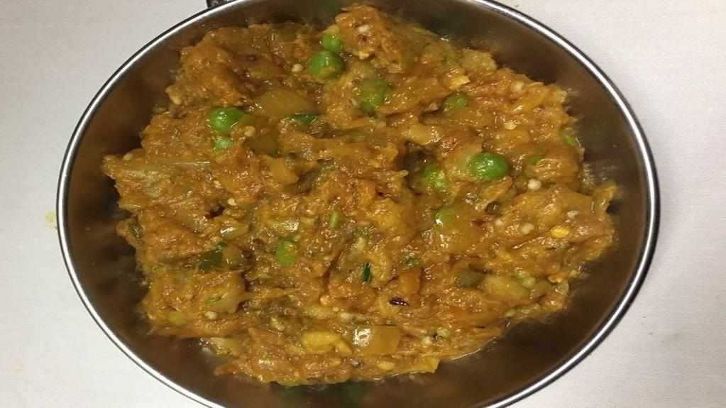 Baingan Bharta · Eggplant roasted, sautéed with tomatoes, onion, and garlic. Served with rice.