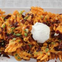 Loaded Waffle Fries · Crispy waffle fries covered in bacon, cheese, and sour cream.