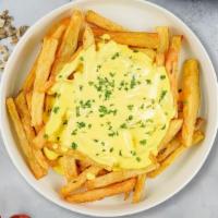 Cajun Cheese Fries  · Deep fried crispy cajun potato fries topped with melted cheese.