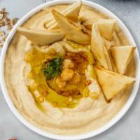 Hummus Platter · Homestyle hummus platter with tahini spiced to perfection with fried pita chips.