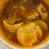 Seafood Soondubu Jjigae · Hot stew with soft tofu, pork, seafood scallions + rice.