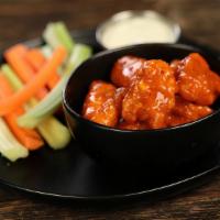 Boneless Classic Buffalo · 8 boneless wings tossed in classic buffalo (medium heat), served with carrots & celery and a...