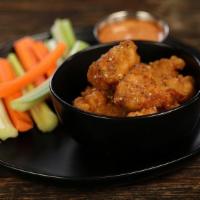 Boneless Lemon Pepper · 8 boneless wings tossed in lemon pepper (mild heat), served with carrots & celery and a dipp...