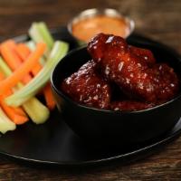 Boneless Teriyaki · 8 boneless wings tossed in teriyaki (mild heat), served with carrots & celery and a dipping ...