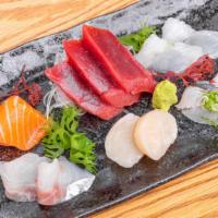 Sashimi Deluxe · 13 pieces sashimi of six varieties of fish. Sashimi is selected based on market availability.