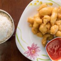 Sweet And Sour Chicken · With white rice and sauce on side.