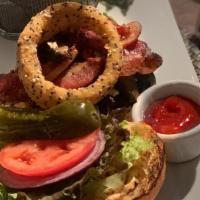 The Banker
 · Cajun beef burger, roasted pepper, portabella,
goat cheese, bacon, quinoa onion ring,
chipot...