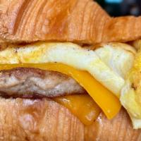 Croissant Sausage Egg & Cheese · Premium Sausage + Freshly made Croissant + Egg + Cheddar Cheese all cooked to perfection