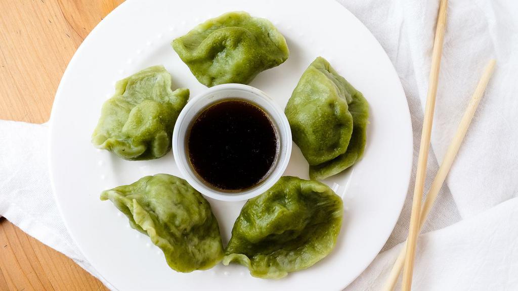 Veggie Dumplings (5) · Served with vegan soy vinaigrette.