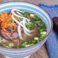 Braised Short Ribs Pho · Boneless short ribs slow braised topped with pineapple chili coulis.