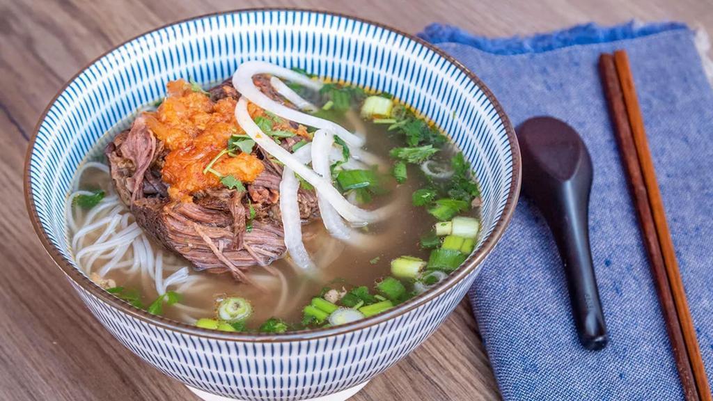 Braised Short Ribs Pho · Boneless short ribs slow braised topped with pineapple chili coulis.