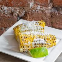Corn Elote · Grilled corn with cotija cheese. * 
 
*Chef Recommended