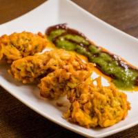 Onion Bhujia · Diced onion fried chickpea batter.