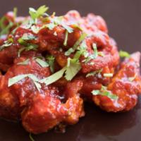 Chicken Manchurian · Tossed in a spicy and sweet chutney.