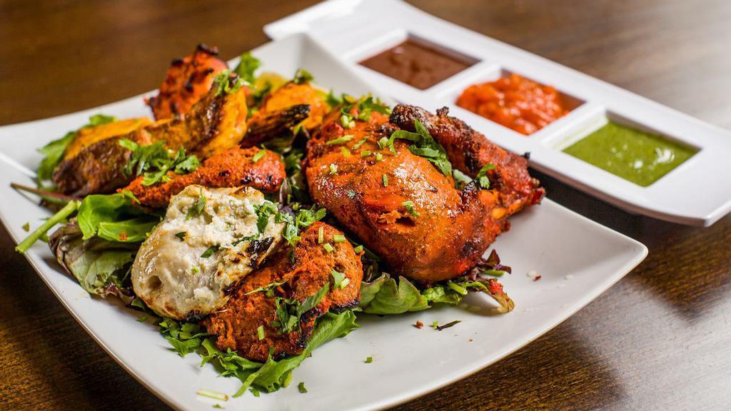 Combination Platter · Chicken malai kebab, chicken tikka, barrah kebab and fish tikka.