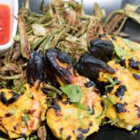 Tandoori Prawn · Jumbo shrimp marinated in fresh herbs and spices.