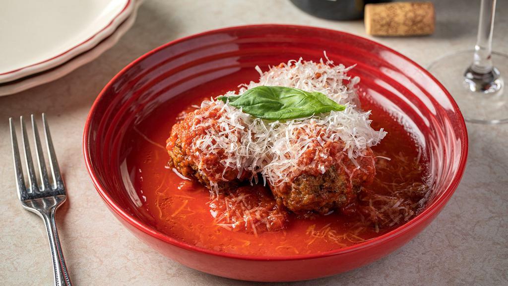 Meatballs · Three meatballs made with pork, beef, and veal make them tender and always pink in the center because of the veal content (but always cooked thoroughly).  Contains dairy and gluten in meatballs