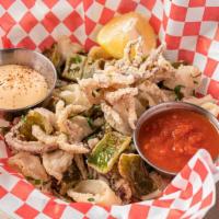 Fried Calamari · Fresh squid, Cubanelle and Italian long-hot peppers battered in rice flour and fried until g...