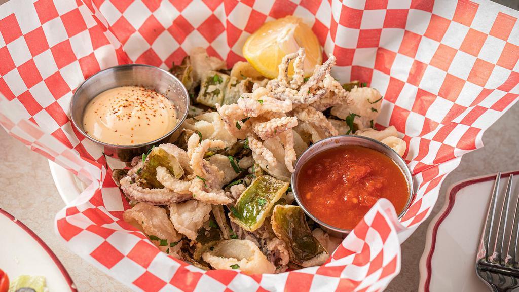 Fried Calamari · Fresh squid, Cubanelle and Italian long-hot peppers battered in rice flour and fried until golden brown. Served with Tomato Sauce and Tabasco mayo