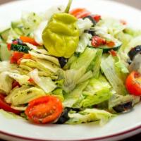 Side Salad · Iceberg lettuce, cucumber, tomato, olives, roasted red pepper, pepperoncini, oregano, zesty ...