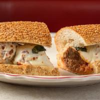 Meatball Parm Hero · Our meatballs are made with pork, beef, and veal making them tender and always pink in the c...