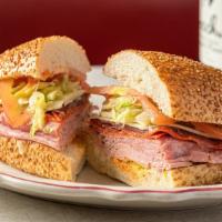 Italian Combo Hero · Five types of meat, provolone, lettuce, tomato, pepperoncini, house spicy sauce, and zesty d...