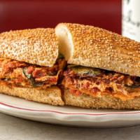 Eggplant Parm Hero · Our 10 layer eggplant parm. Served on a Sesame hero with tomato sauce and fresh basil