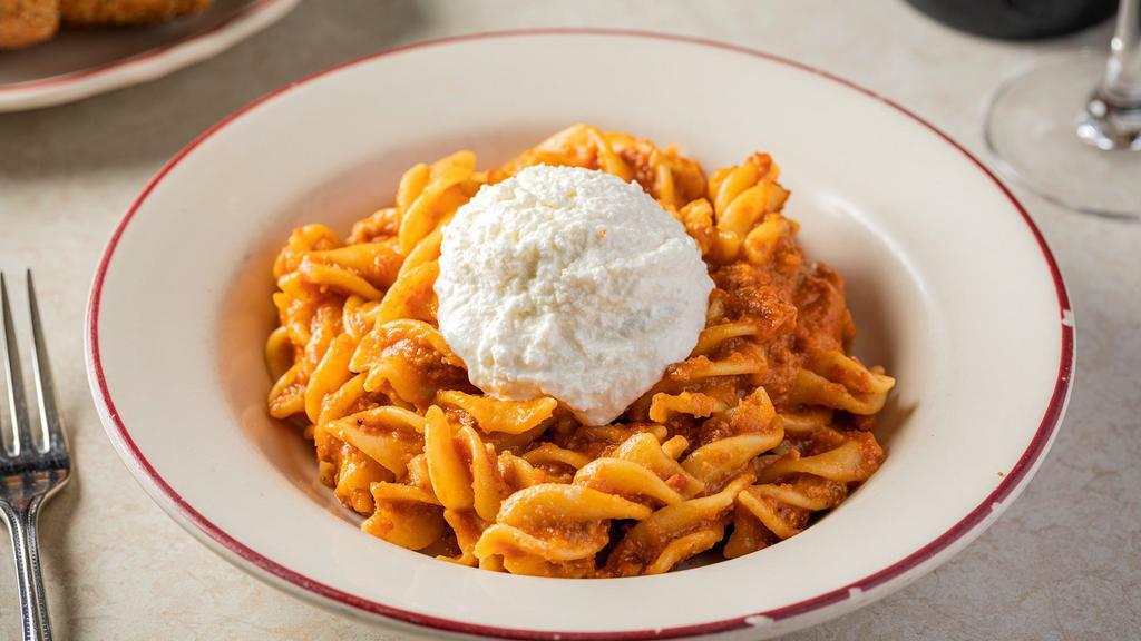 Fusilli Bolognese · Homemade fusilli pasta, tossed in our own pork/beef Bolognese that includes grated parmesan and tomato sauce and then topped with fresh ricotta