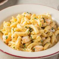 Penne Scampi · Our own spin on scampi with homemade penne (garganelli) noodles, chopped shrimp cooked in a ...