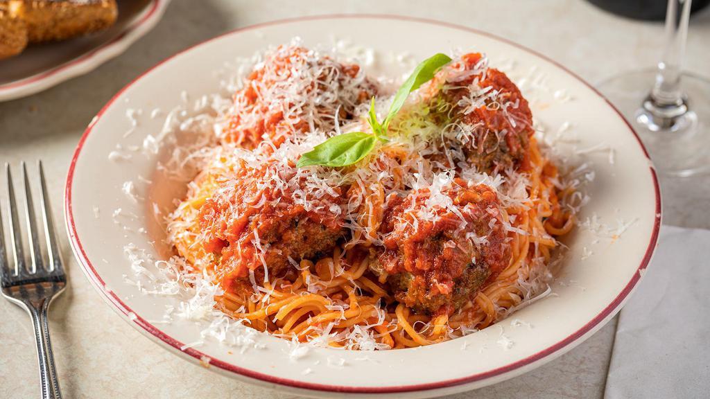 Spaghetti Meatballs · Three of our meatballs served over spaghetti topped with tomato sauce, parmesan, and basil