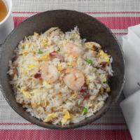 Fried Rice · Stir-fired rice with roast pork or chicken, egg, onions, green peas,  in soy sauce- Pineappl...