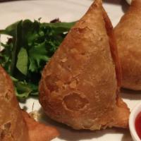 Vegetable Samosas (2 Pieces) · Spicy seasoned potatoes and peas wrapped in a light pastry.