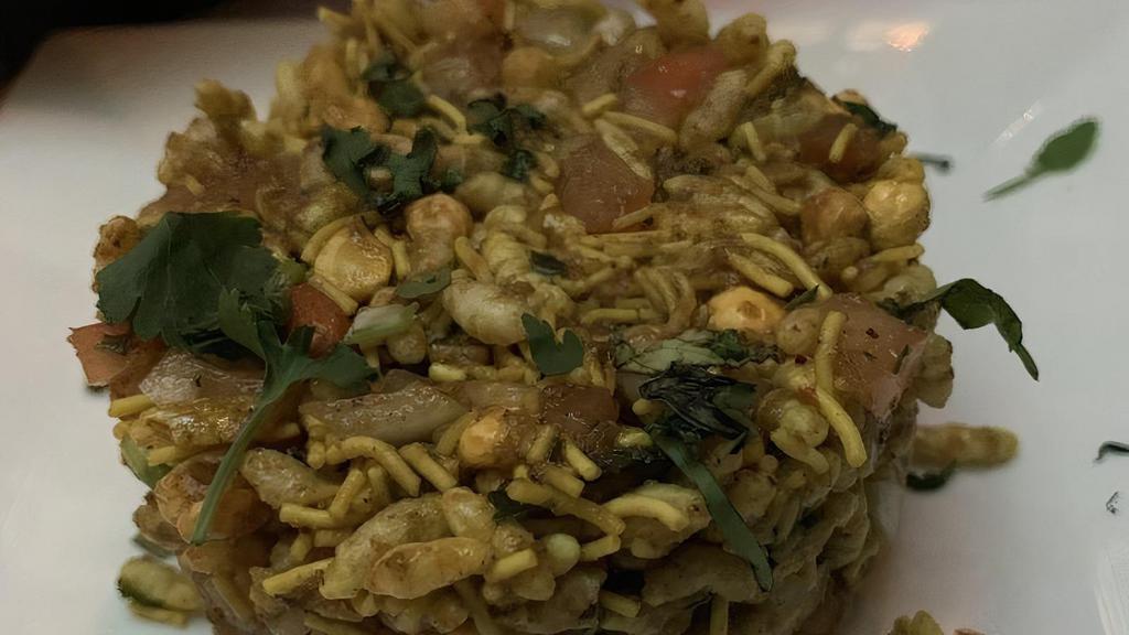 Bhel Puri · Puffed rice, potatoes, onions with a mixture of tangy tamarind & spicy mint chutney.