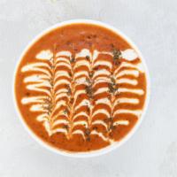Dal Makhani · Whole black lentils (urad) simmered in tomatoes and onions.