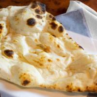 Naan · White flour soft bread cooked in a clay oven.
