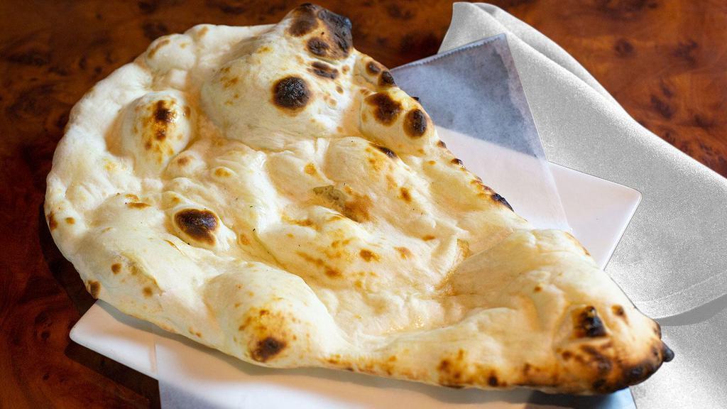 Naan · White flour soft bread cooked in a clay oven.