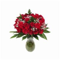 Happy Holiday Bouquet · Comes with a dozen of red roses in a clear vase.