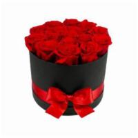 Lovely Flower · Consists of 12-14 preserved red roses in a round black box with a ribbon.