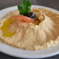 Antioch Style Hummus · Chickpeas mashed into a paste with lemon juice, olive oil and flavored with tahini.