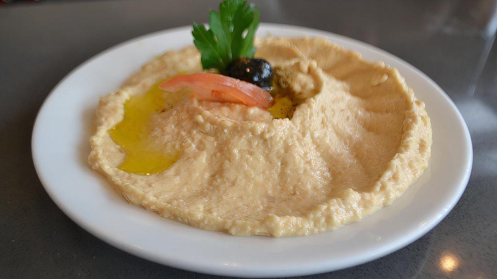 Antioch Style Hummus · Chickpeas mashed into a paste with lemon juice, olive oil and flavored with tahini.