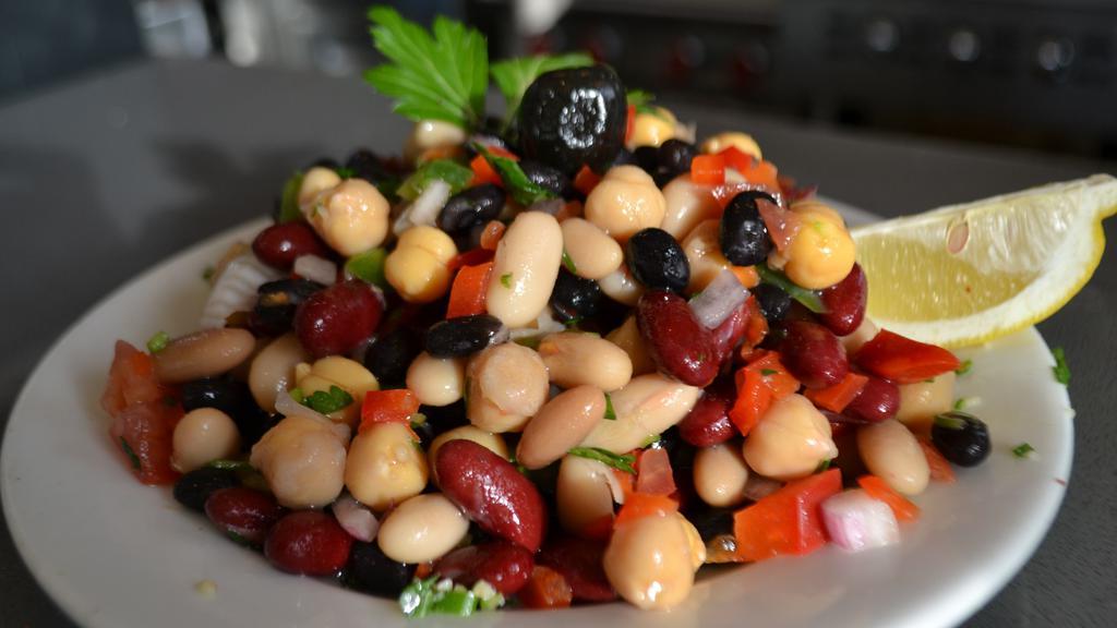 Piyaz · White beans, red beans, red pepper, green pepper, parsley, red onion and chickpeas marinated with lemon juice and olive oil.