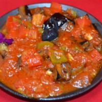 Sauced Eggplant · Pan fried small pieces of eggplant in sauce of fresh tomatoes, green peppers, onions and gar...