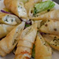 5 Piece Feta Cheese Roll · Delicate filo dough wrapped with feta cheese and parsley, deep fried.