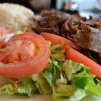 Gyro · Layers of marinated ground meat, wrapped around the large vertical split and grilled in fron...