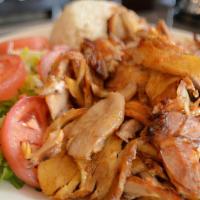 Chicken Gyro · Layers of marinated chicken thighs wrapped around the large vertical split and grilled in fr...